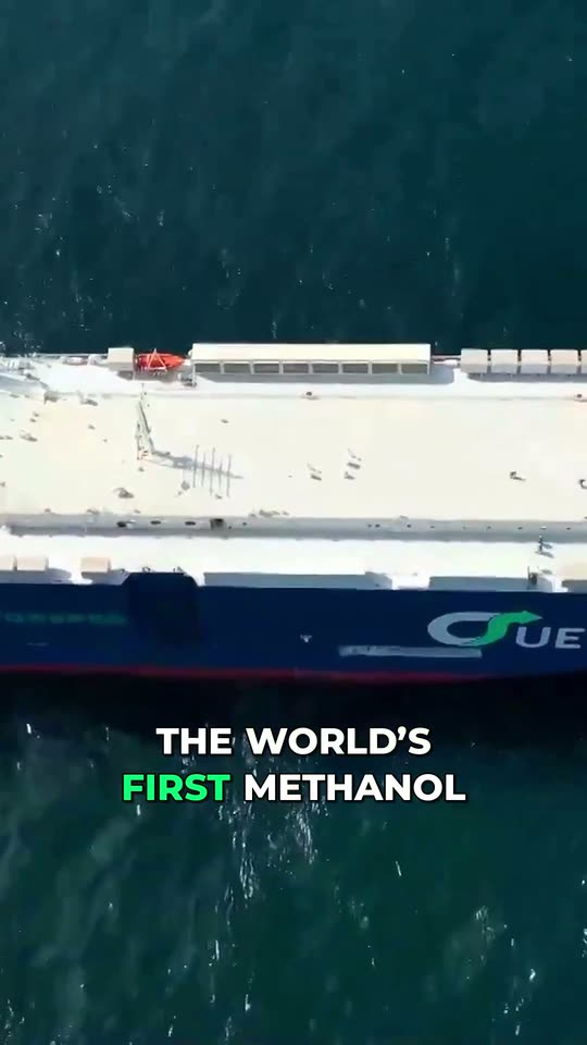 Vertical Short: a finished container hull leaving the yard under gantry cranes, with a burned-in English caption.