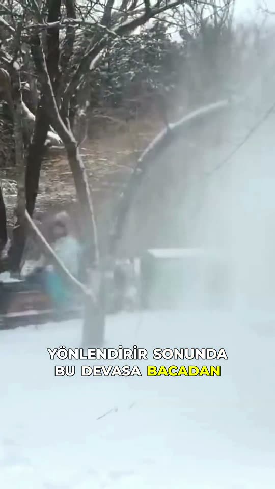 Vertical Short: a rotary snow plough throwing a white plume clear of the track, with a burned-in Turkish caption.